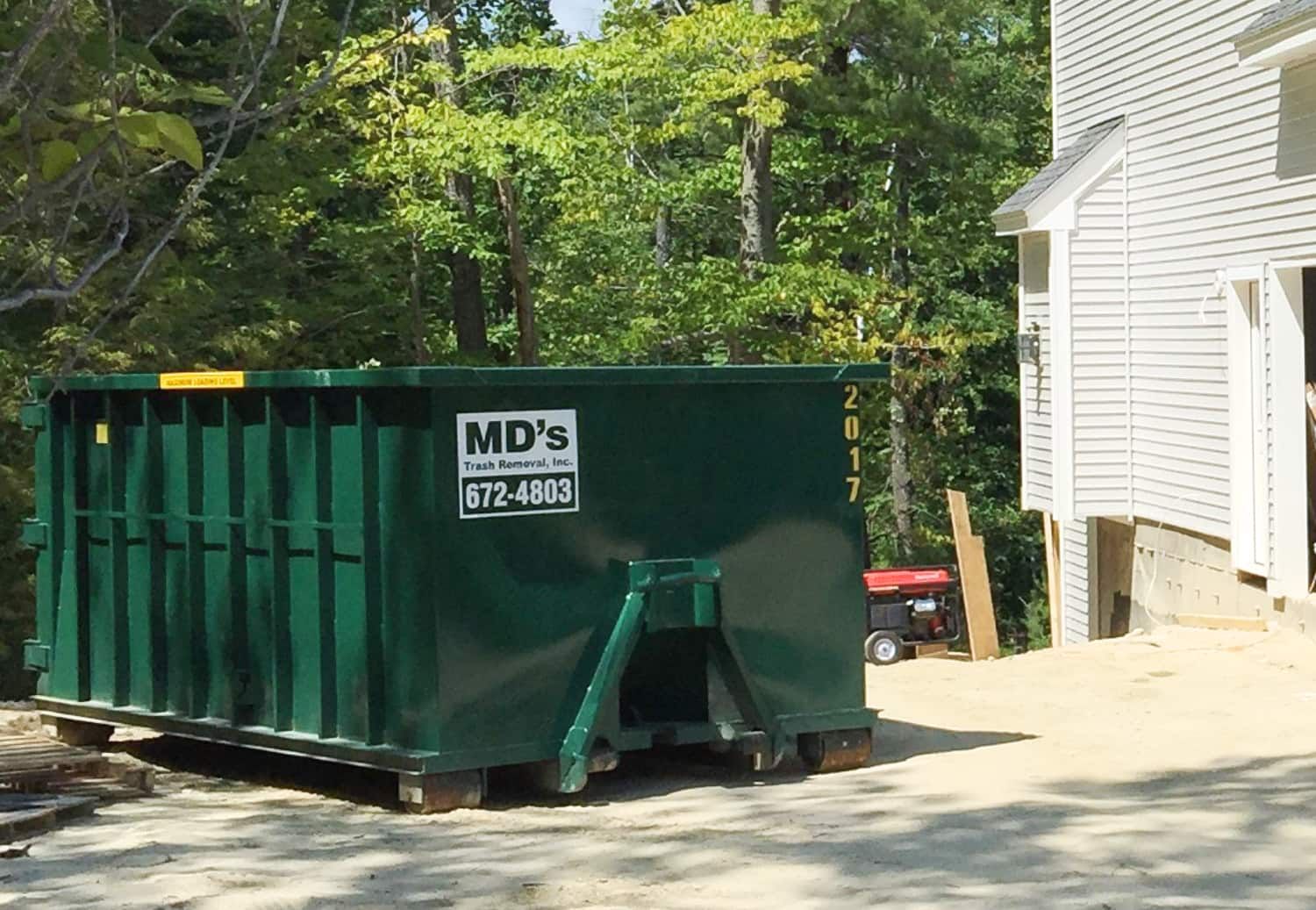 MD's Roll off Dumpster outside house