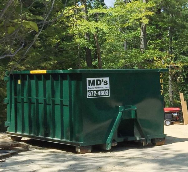 MD's Roll off Dumpster outside house